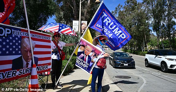 Trump supporters gather at the entrance to the Ronald Reagan Library in Simi Valley, California, on September 27, 223 ahead of the second GOP debate here, which the former president will not attend.  (Photo by Frederic J. BROWN/AFP) (Photo by FREDERIC J. BROWN/AFP via Getty Images)