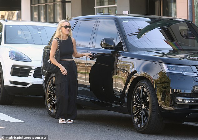 Jackie 'O' Henderson, 48, (pictured) proudly debuted her new Range Rover Sport on Tuesday during a shopping trip in Sydney's Paddington, after admitting she had scored the luxury car because its intended owner was going to prison