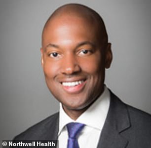 A guest who attended a surprise birthday dinner in Queens for a prominent black doctor (pictured) says his white neighbor made him feel 