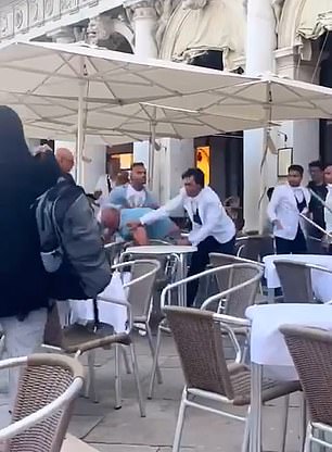 Footage shows a group of men pushing each other and bumping into tables and chairs (pictured here) on the outdoor terrace of Caffè Chioggia in St. Mark's Square