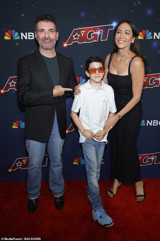 Family: Simon Cowell and his fiancée Lauren Silverman made a rare public appearance with their son Eric on Wednesday during the live finals of America's Got Talent