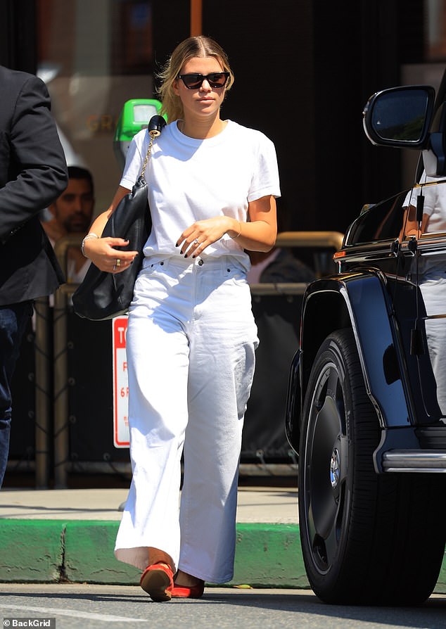 In white: After walking down the aisle earlier this year, Sofia Richie wore all white again to a luncheon in Beverly Hills, California on Monday