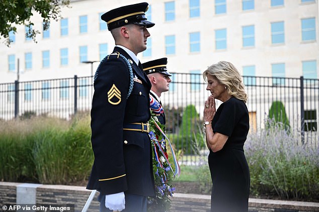 Jill Biden folds her hands in prayer in front of the wreath at the 9/11 Memorial at the Pentagon