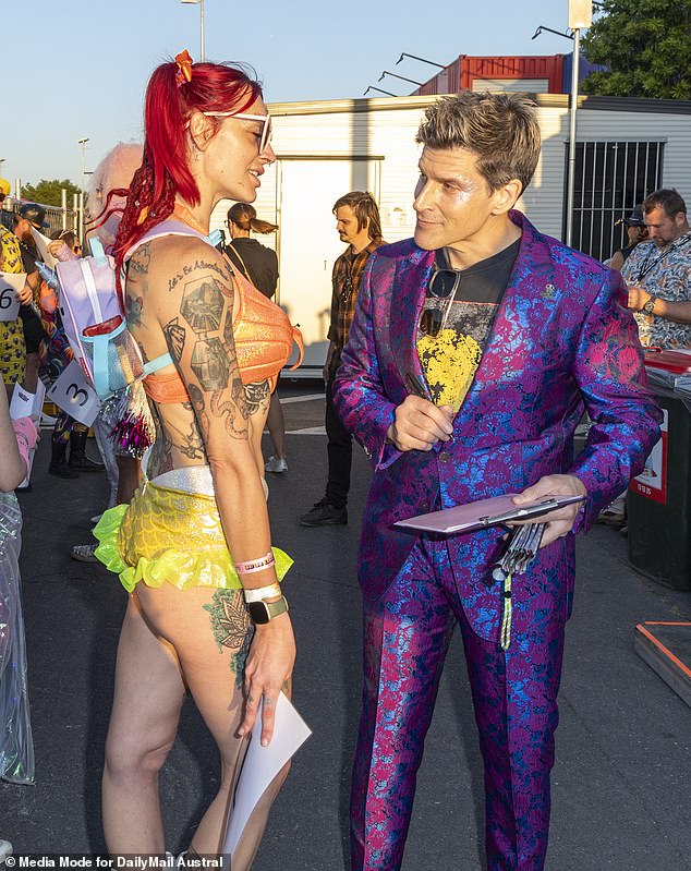 Host Osher Gunsberg (right) is pictured taking notes the old-fashioned way, with pen and paper