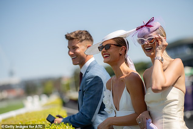 Jordan swept her golden locks back into a low ponytail as she accessorized her look with a pair of subtle heels and a bright red handbag to match her makeup