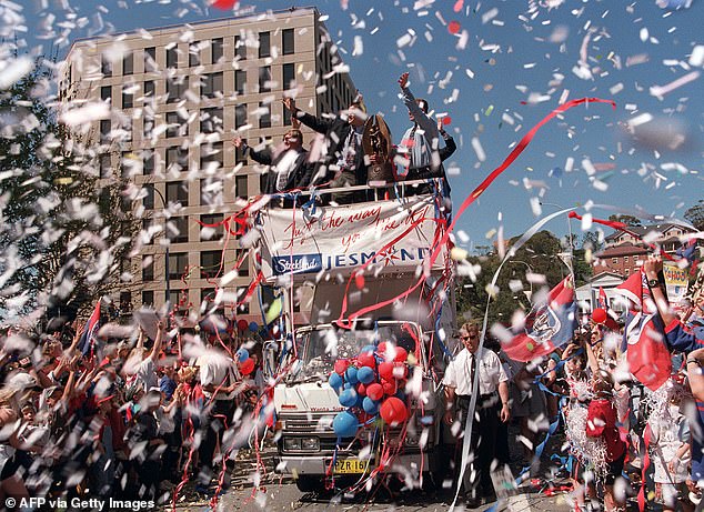 Knights players celebrate on the back of a lorry in front of a reception by 50,000 supporters during a parade through the streets of Newcastle in 1997