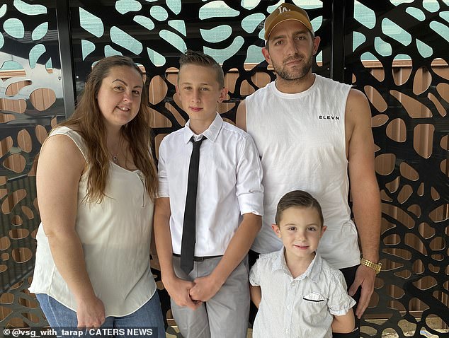 Tara spent $200 a week on fast food like KFC, McDonald's or pizza every day, sometimes more than once (pictured with her husband David, 31, and sons Tyler, 15, and Elijah, nine)