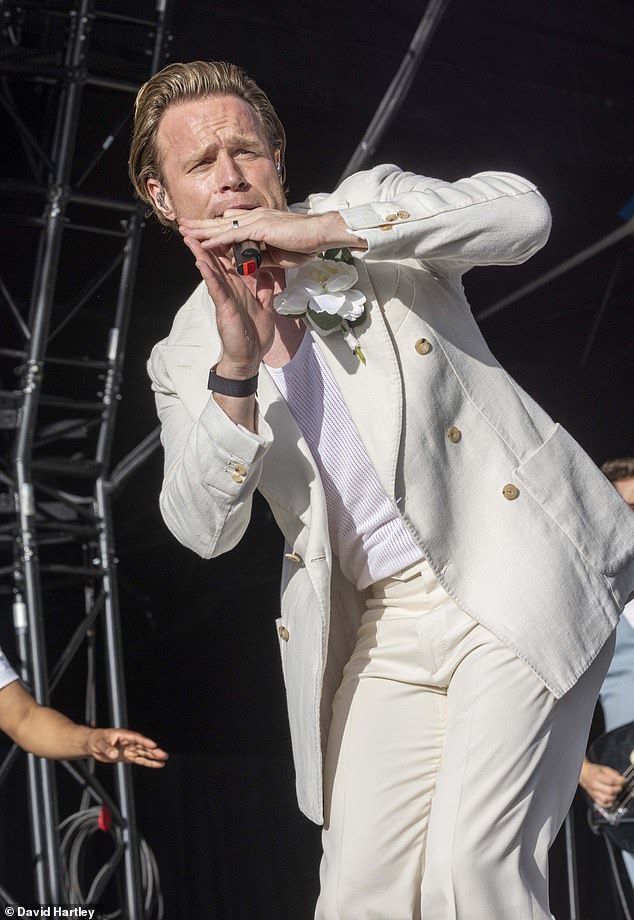 Pop star: Singer-songwriter Olly Murs, 39, will join Take That on their mega-stadium tour of Britain and Ireland