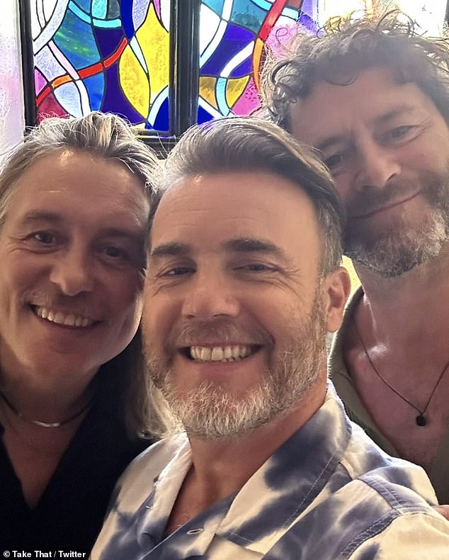 Take That reunite as Gary Barlow Howard Donald and Mark