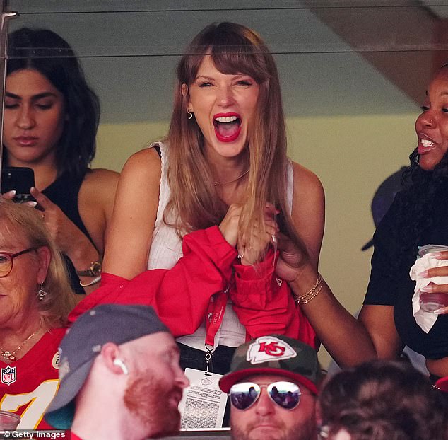 Yay: The singer, 33, and the Kansas City Chiefs star, 34, have reportedly been dating since July - with Taylor attending his team's game against the Chicago Bears this weekend (pictured) - before enjoying dinner and a night out until 2am