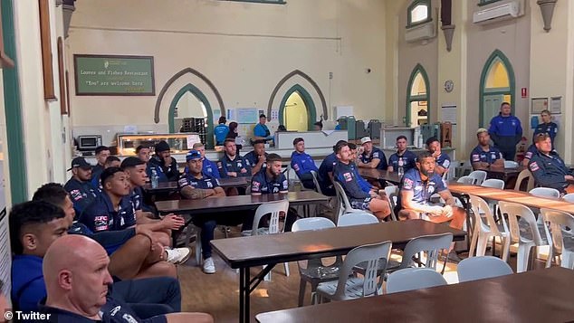 Bulldogs players and staff listen intently as they learn about the work of the Rev.  Bill Crews Foundation to help Sydney's poor and hungry