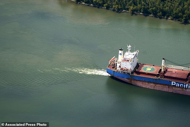 This aerial photo shows sediment and mixed river water as a tanker moves upstream in Plaquemines Parish, Louisiana, on September 26, 2023