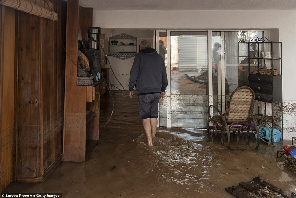 A man in his home flooded by the rain, on September 3, 2023, in Les Cases d'Alcanar, Tarragona, Catalonia, Spain