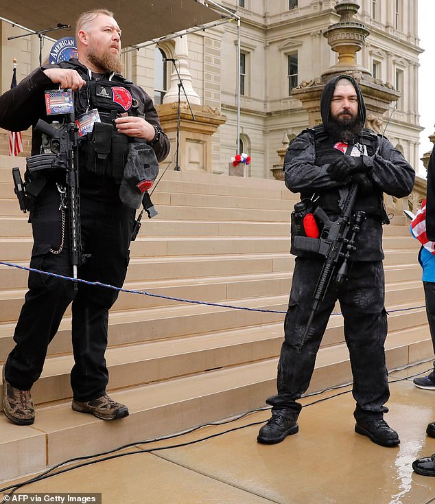 Michael Null (left) and William Null (right) at a protest outside the Michigan State Capitol in Lansing.  The twin brothers were found innocent on Friday