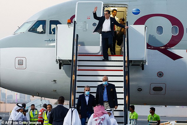 US citizens Siamak Namazi (C-back), Emad Sharqi (below-L) and Morad Tahbaz (below-R) disembark from a Qatari jet upon arrival at Doha International Airport in Doha on September 18, 2023