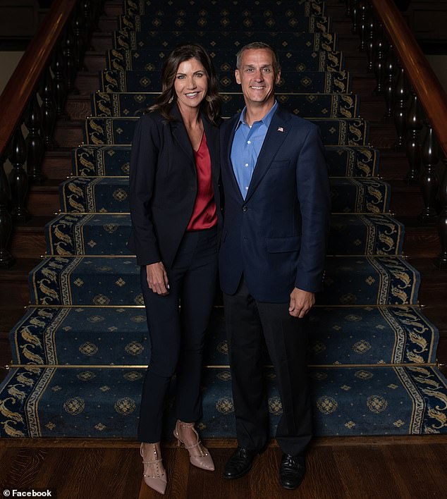 Noem's chances of joining Trump on the 2024 ticket could be threatened after DailyMail.com revealed that married South Dakota governor and ex-Trump adviser Corey Lewandowski, also married, had a yearlong affair .  The two are pictured above in Ohio in 2020