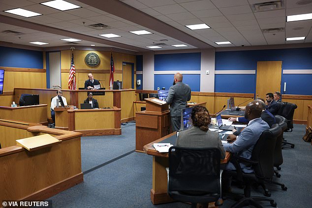 Defense attorney Scott Grubman, defending Ken Chesebro, pleads with Fulton County Superior Court Judge Scott McAfee.  Television cameras were allowed to participate in a hearing in one of the cases against Donald Trump in Atlanta, Georgia, for the first time on Wednesday