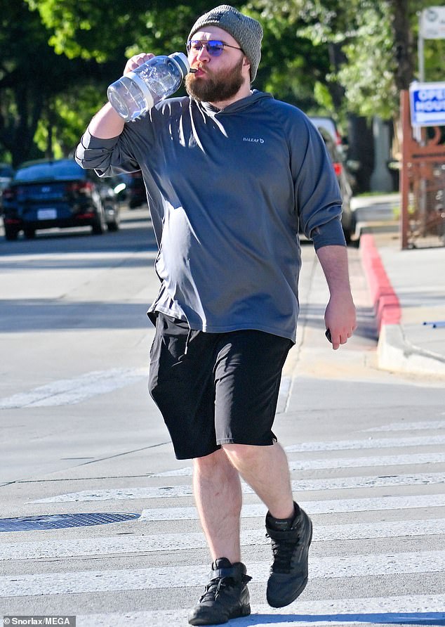 Stay hydrated: Two And A Half Men actor Angus T Jones was unrecognizable from his child star days when he was spotted in Los Angeles this week