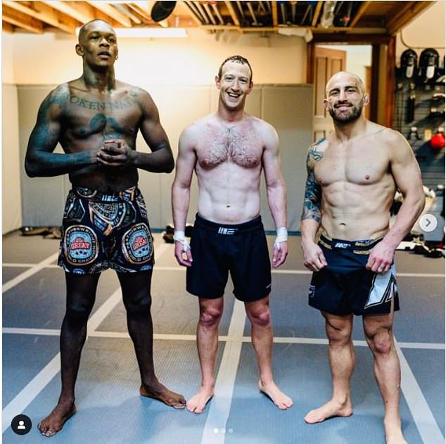 Adesanya showed his shock when he first saw Mark Zuckerberg (pictured, center, with Israel and Alex Volkanovki, right) with his shirt off