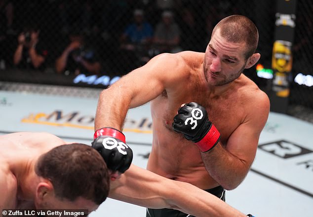 Strickland, 32, is fighting for the UFC middleweight title and was hit with a sled