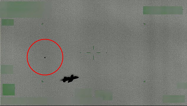 U.S. Customs and Border Protection has uploaded 10 videos showing craft moving in strange ways in our skies.  One video documents a fighter jet being chased by an apparent flying orb (above), with key technical details of the service's infrared camera redacted