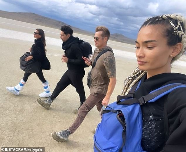 Kelly Gale, 28, (right) and her fiancé Joel Kinnaman, 43, (second from right) battled challenging weather conditions on Sunday as they set out for the Burning Man Festival in the Nevada desert