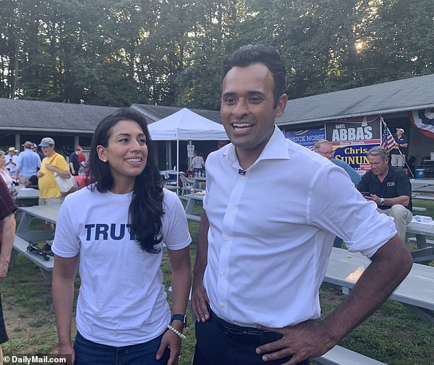 Presidential hopeful Vivek Ramaswamy told DailyMail.com at a picnic in Salem, New Hampshire, on Monday that he is not in favor of mental competence tests for members of Congress, arguing that it is the voters who decide who to elect and keep in office.  Pictured: Ramaswamy (right) and his wife Apoorva attend the Salem GOP Labor Day Picnic on Monday