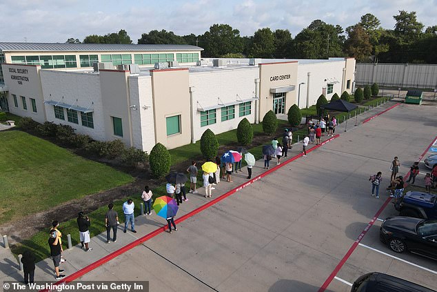 People wait in line at a Social Security office before it opens on July 13, 2022 in Houston, Texas