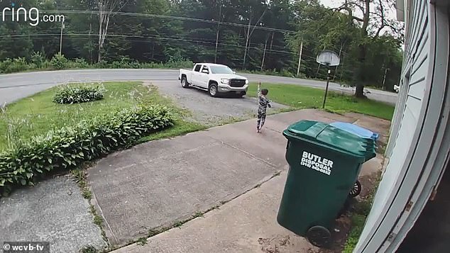 Eight-year-old Isaih Lobdell stopped his father Tyler Lobdell for a hug before the pickup left the driveway