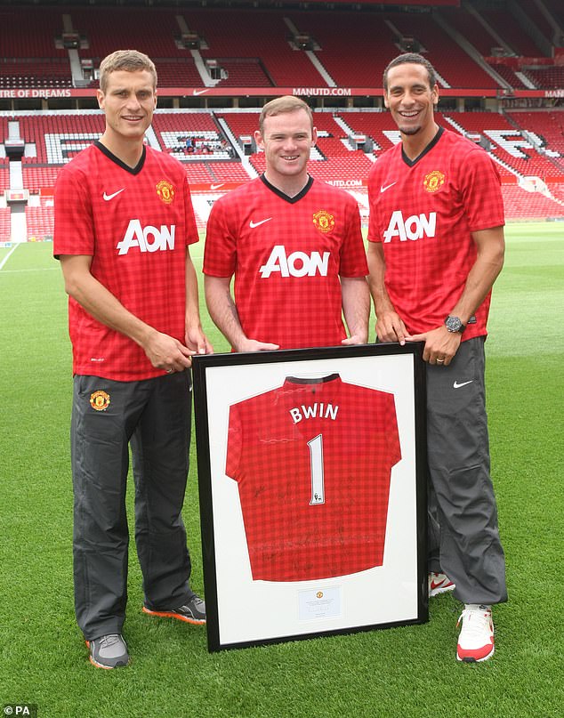 Rio Ferdinand (right) revealed that Wayne Rooney (centre) found Nemanja Vidic (left) 'terrible' during his first training with Manchester United