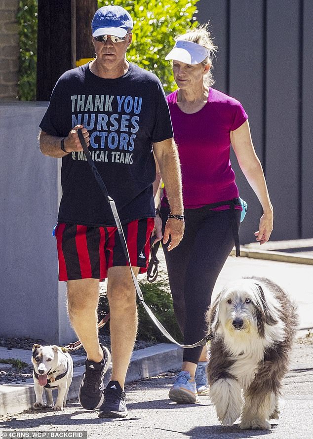 Out and about: Will Ferrell and his wife, Viveca Paulin, were spotted walking their dogs in Los Angeles