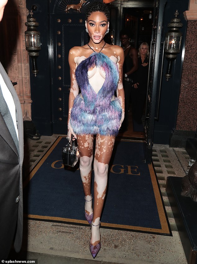 Stunning: Winnie Harlow, 29, made sure all eyes were on her as she slipped into a sizzling fur dress for the British Vogue X Moncler Vogue World Party in George on Thursday