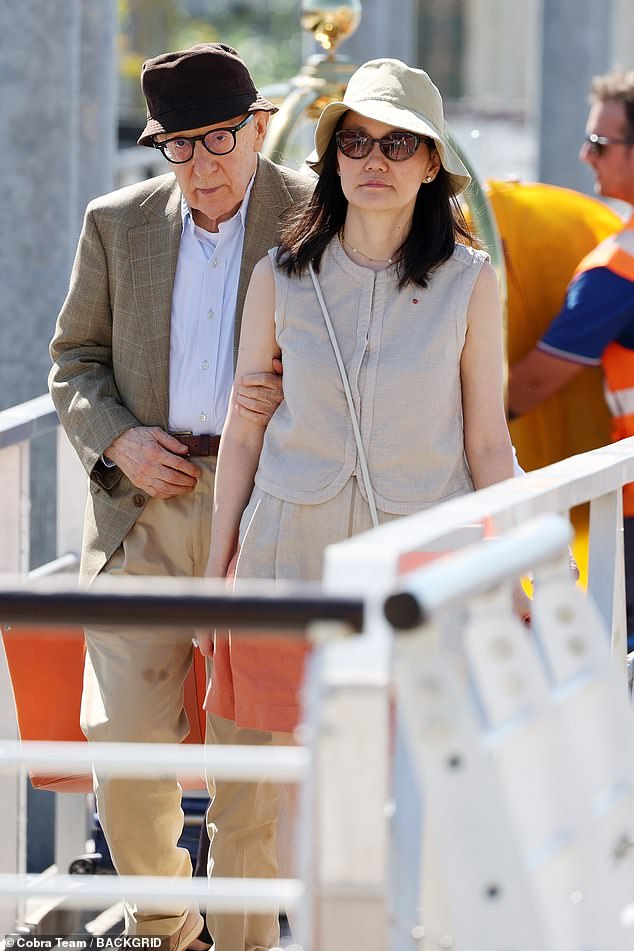 Exit: Controversial director Woody Allen left Venice with his family on Wednesday after attending the 80th Venice International Film Festival