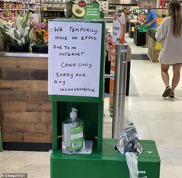 Several Woolworths stores were hit by an EFTPOS outage on Friday, with shoppers asked to pay for their groceries in cash (pictured)