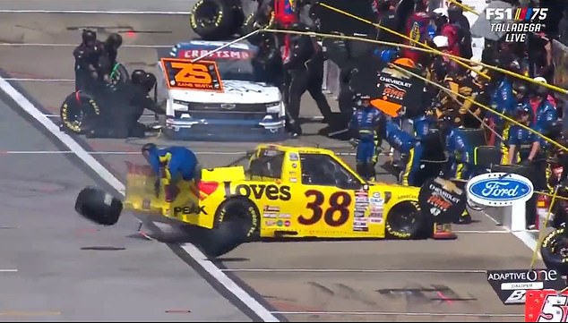 Smith's truck spun out before hitting his tire carrier named Charles Plank in pit road