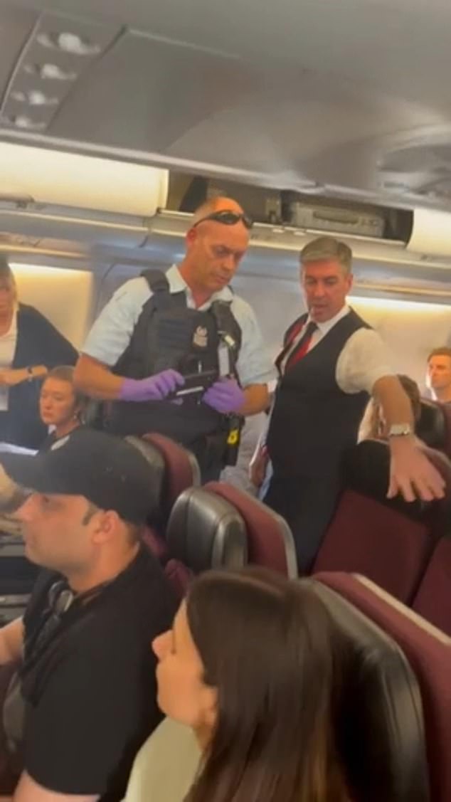 After the man was removed from the plane, police reportedly searched his seat (photo)