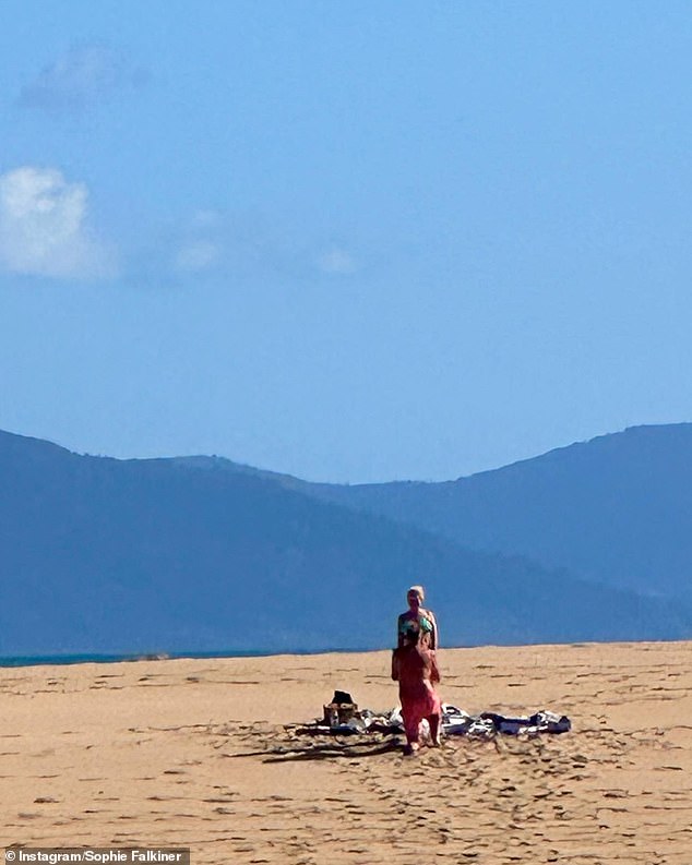 Sophie's joy was palpable as she shared a series of heartwarming photos from the moment Steve popped the question during a dreamy holiday in the Whitsunday Islands.