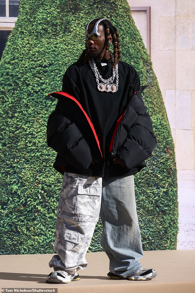 #Looking good: Offset looked typically stylish in baggy jeans, paired with a black oversized T-shirt and a padded jacket