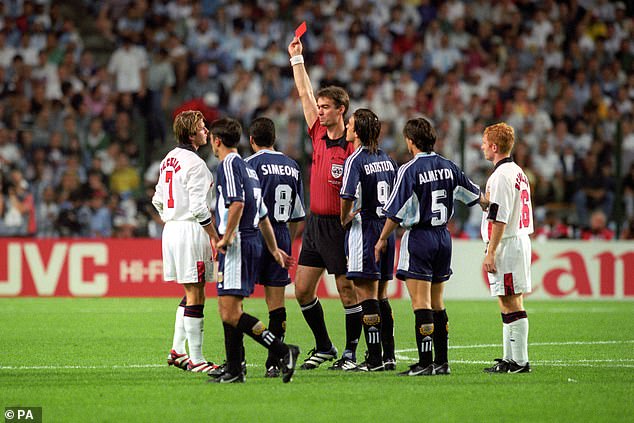 Back in the day: The football star, now 48, was sent off against Argentina after kicking the back of Diego Simeone's leg and lunging at the Argentina captain after pushing him to the ground