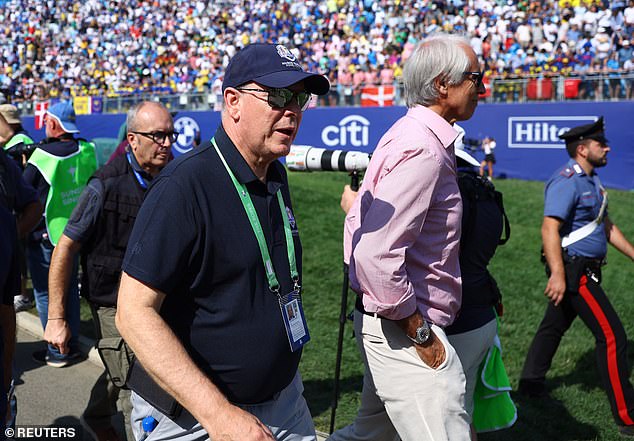 He kept busy as he walked across the field, stopping occasionally to mingle with other attendees