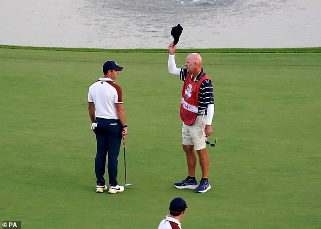 It comes after a dispute between Patrick Cantlay's caddy Joe LaCava (right) and Rory McIlroy after he was seen waving a cap in the golfer's eyeline