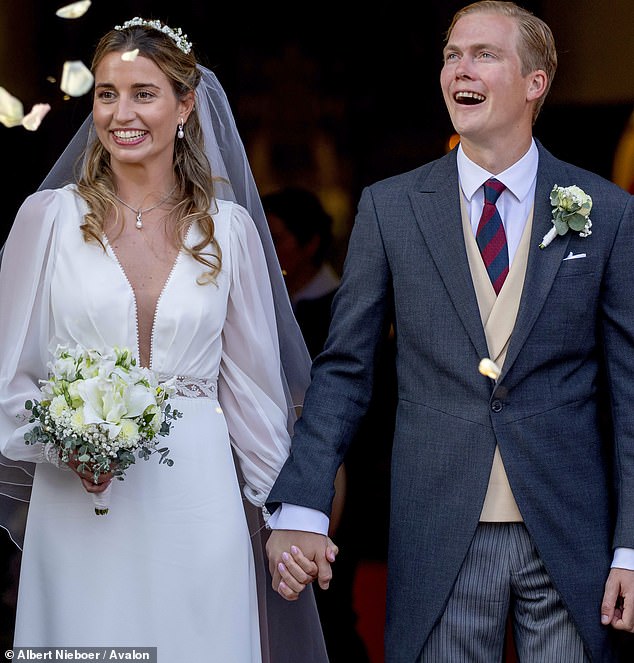 The Archduke appeared delighted as he held hands with his bride after they said their 'I do's' in church