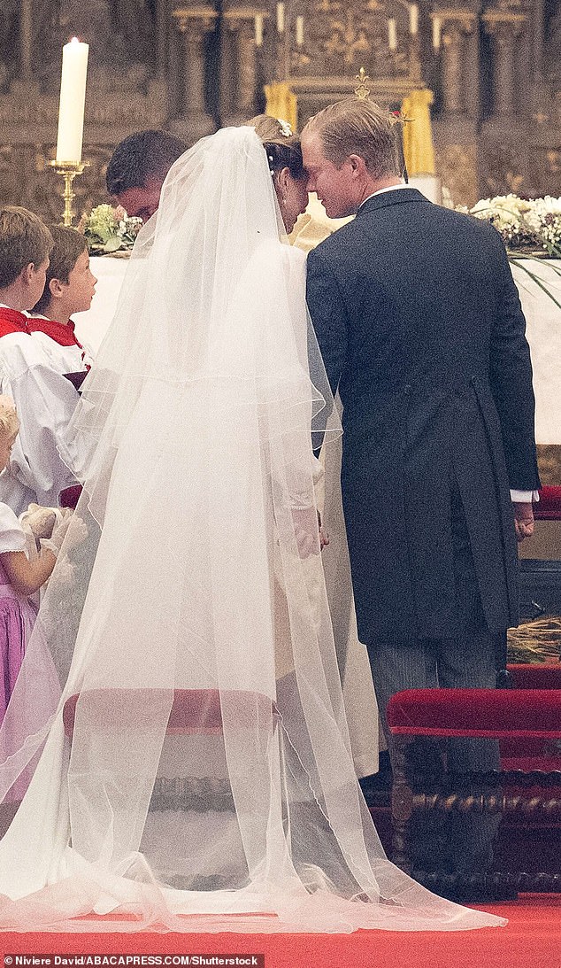 VOWS: The couple shares an intimate moment during their wedding ceremony in the Church of Saint Pierre of Beloeil