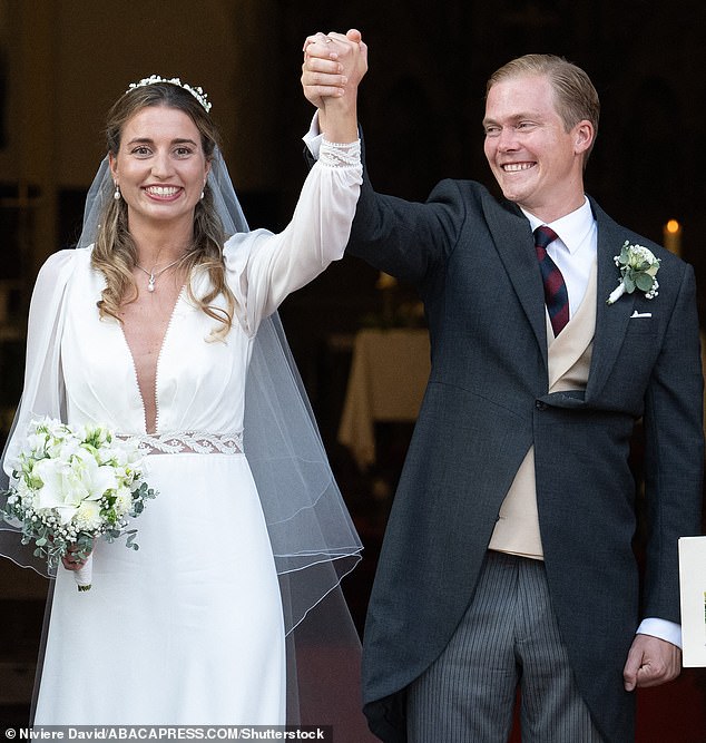 The groom appeared to look lovingly in his bride's direction as they left the church after speaking their minds