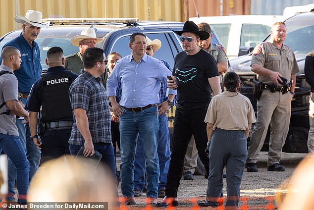 The Twitter czar is seen Thursday in the town of Eagle Pass, Texas, with Congressman Tony Gonzalez