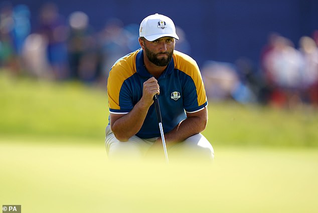 Jon Rahm (pictured) saved half a point for Europe in his headline round against Scottie Scheffler