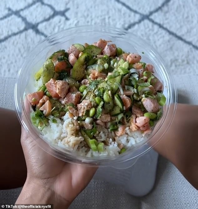 After she finished her workout, she had a granola bar in the car.  Then she grabbed a tuna poke bowl for lunch