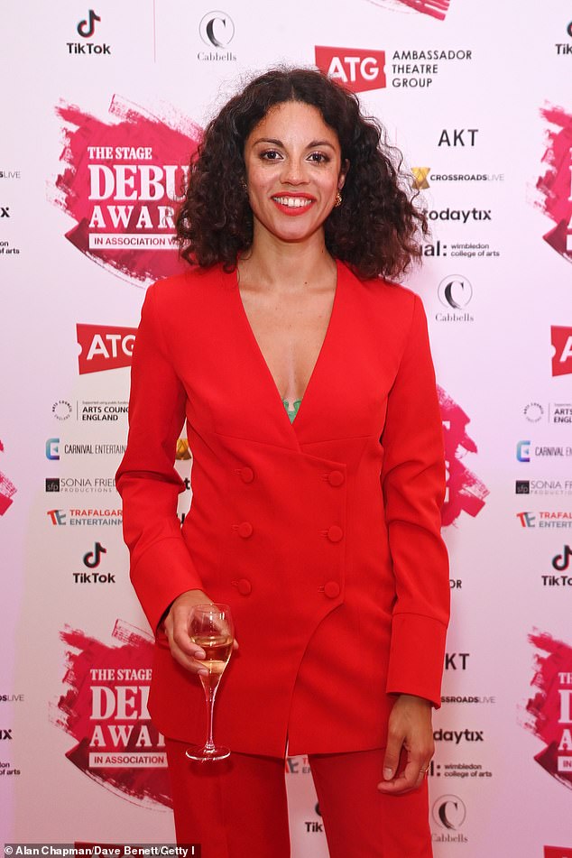 Bold: Composer Anoushka Lucas turned heads in a bright red double-breasted blazer and matching trousers