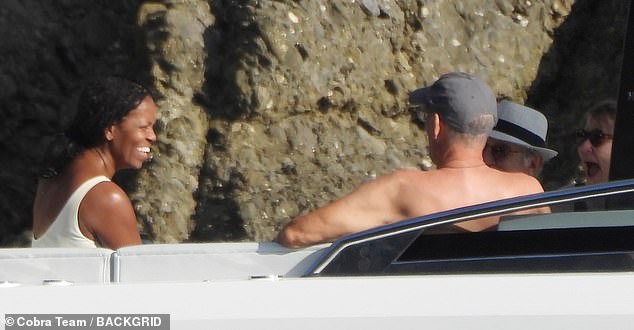 Meanwhile, Michelle Obama, 59, is vacationing aboard Steven Spielberg's yacht near Portofino on the Italian Riviera with Tom Hanks, his wife Rita Wilson and Spielberg's wife Kate Capshaw.