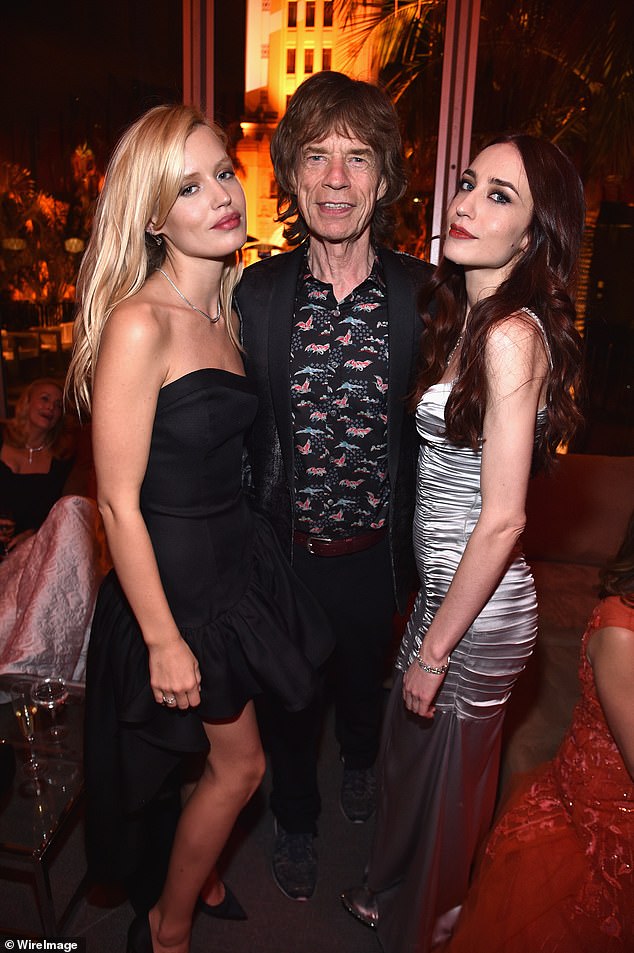 Legacy: Jagger with daughters Georgia May (left) and Elizabeth.  He has hinted that he will leave his fortune to charity rather than to his children